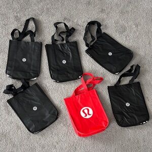 set of lululemon athletica reusable Black and Red Tote Bags